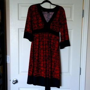 Red and black boho dress with attached sash.